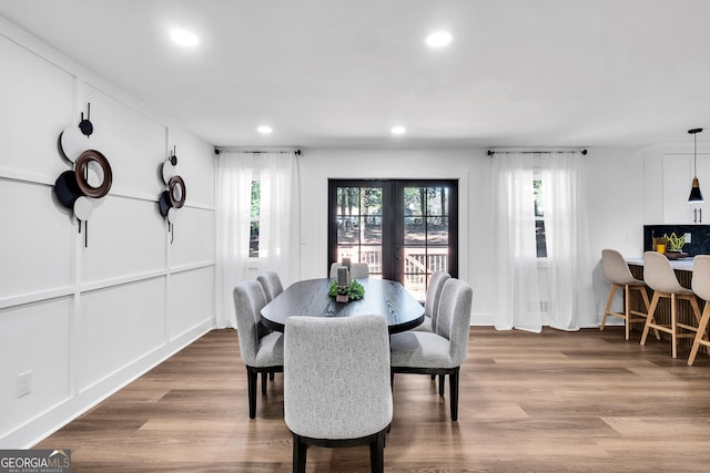 dining area with hardwood / wood-style floors