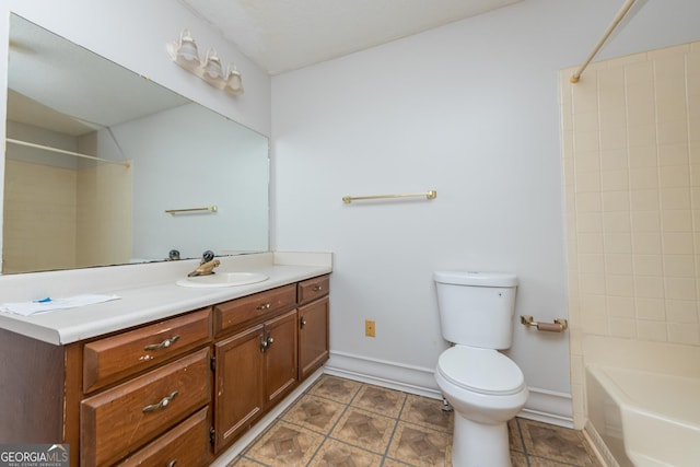 full bathroom with bathtub / shower combination, vanity, and toilet