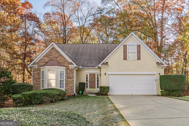 view of front property with a front yard and a garage