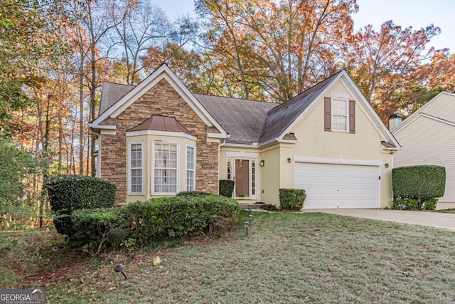 front facade featuring a garage and a front yard