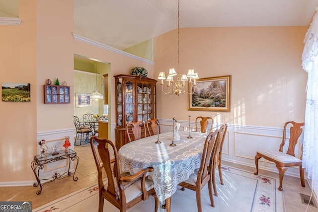 tiled dining area with a chandelier and lofted ceiling