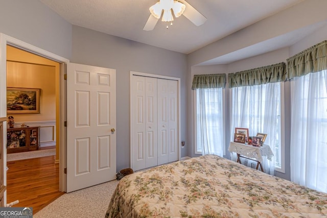 bedroom featuring carpet floors, a closet, and ceiling fan