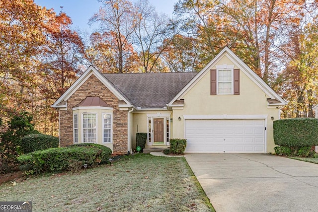 view of front property with a front yard and a garage