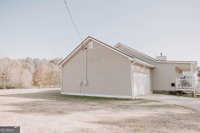 view of side of home with a garage