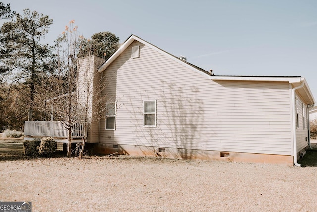 view of home's exterior with a deck