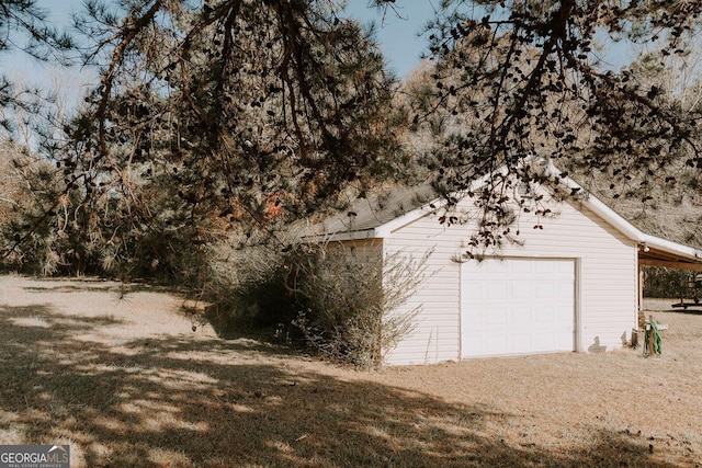 garage featuring a yard