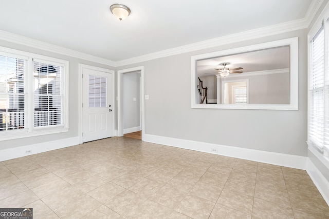 tiled empty room featuring ceiling fan, crown molding, and a healthy amount of sunlight