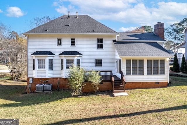 back of property with central AC, a lawn, and a wooden deck