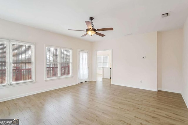 unfurnished room featuring light wood-type flooring and ceiling fan