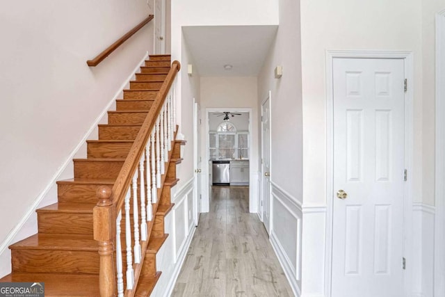 staircase featuring wood-type flooring