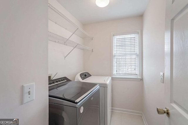 laundry room featuring separate washer and dryer