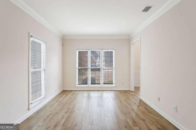 unfurnished room with light wood-type flooring and crown molding