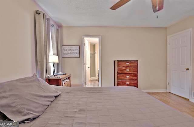 2020 Moore Rd, Moreland, GA 30259 - bedroom with wood finished floors, a ceiling fan, and ensuite bathroom