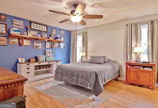 2020 Moore Rd, Moreland, GA 30259 - bedroom featuring a textured ceiling, ceiling fan, and light wood-type flooring