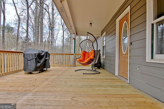 wooden deck with grilling area