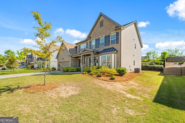 view of front of property with a front lawn and central air condition unit