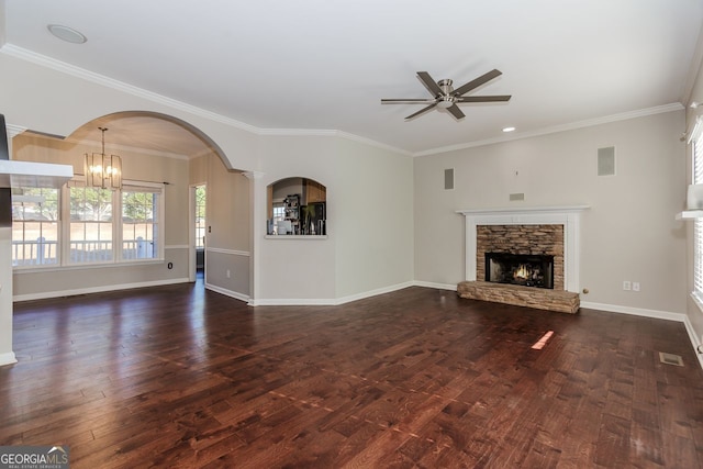 unfurnished living room featuring baseboards, dark wood-type flooring, and a stone fireplace