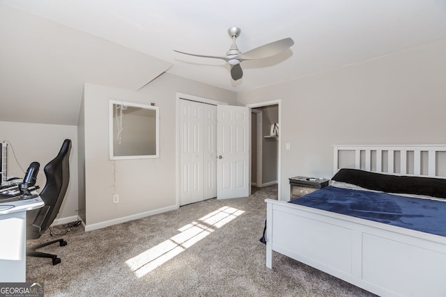 carpeted bedroom featuring lofted ceiling, a closet, ceiling fan, and baseboards