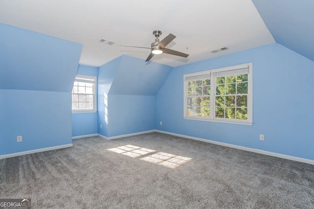 bonus room with ceiling fan, visible vents, and baseboards