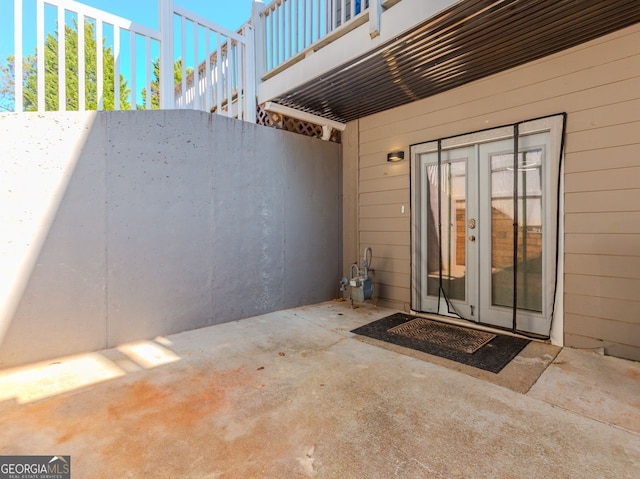 doorway to property with a patio area and french doors