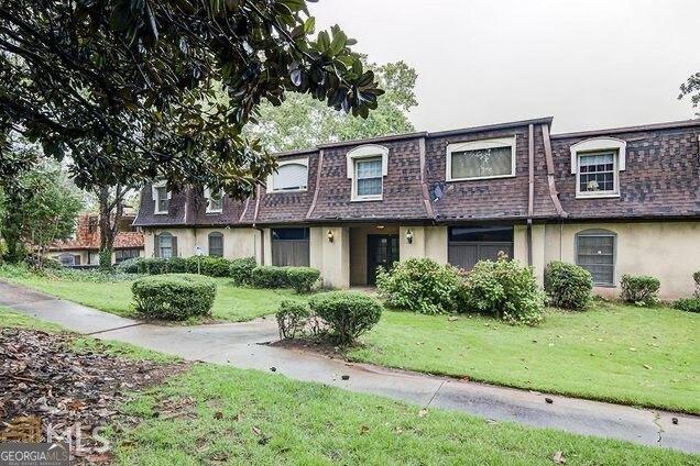 view of property with a front lawn