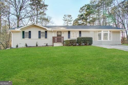 ranch-style home with a front lawn