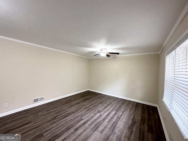 unfurnished room with a textured ceiling, ceiling fan, ornamental molding, and dark wood-type flooring