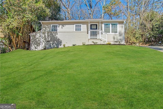 ranch-style home with a front lawn