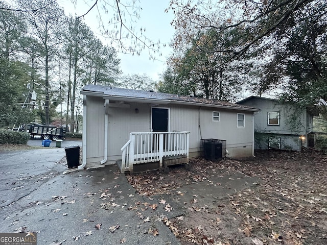 back of house featuring central AC