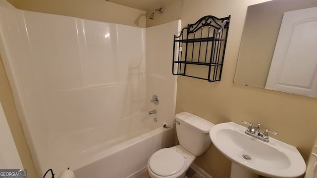 full bathroom featuring  shower combination, toilet, and sink