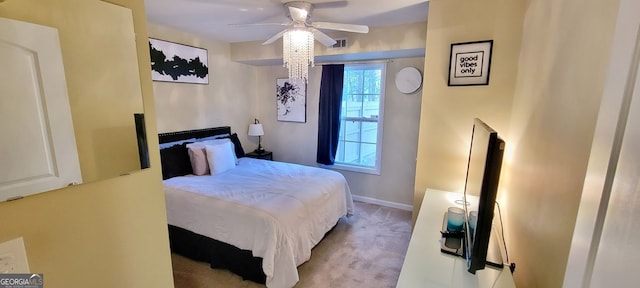 bedroom featuring ceiling fan and light carpet