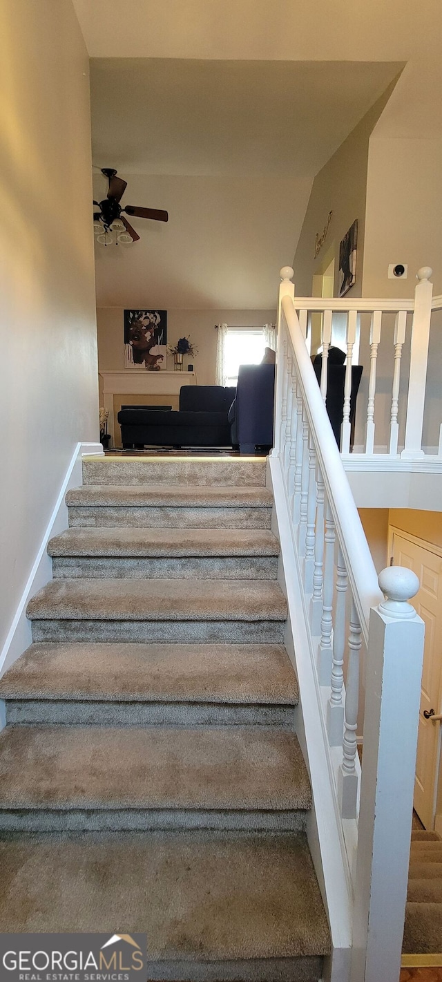 stairway with ceiling fan