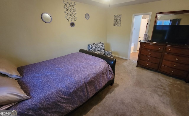 bedroom featuring light carpet