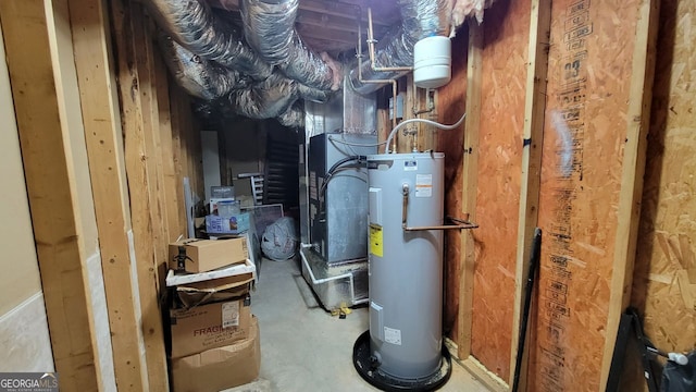 utility room featuring water heater