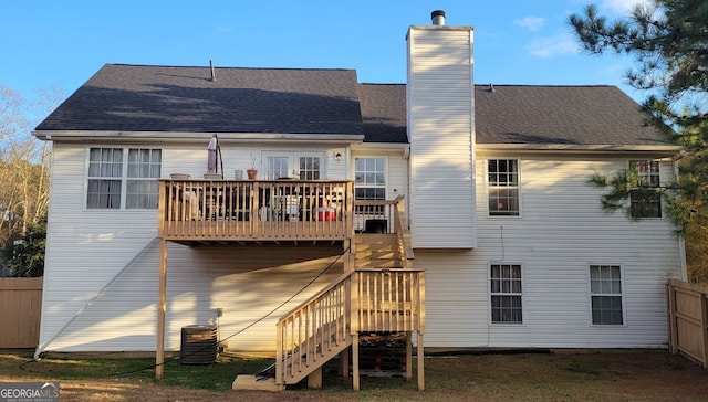 back of property featuring central air condition unit and a deck