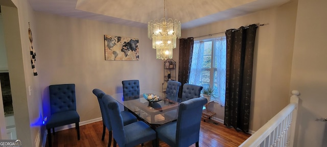 dining area with a notable chandelier and wood-type flooring