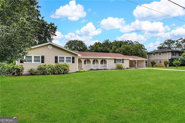 ranch-style home with a front lawn