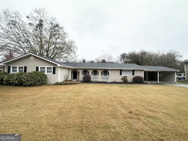 ranch-style house with a carport and a front yard