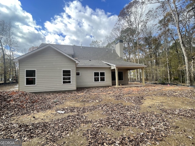 rear view of property featuring a patio area