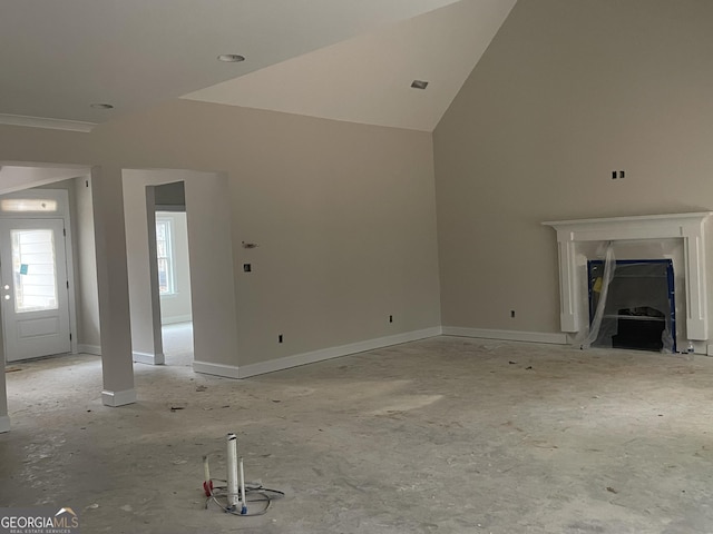 unfurnished living room with lofted ceiling