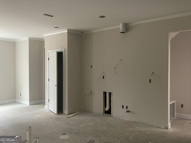 unfurnished room featuring crown molding