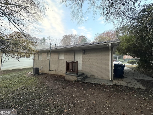 back of property featuring cooling unit