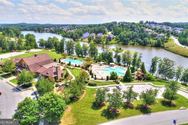 birds eye view of property with a water view