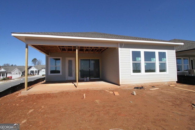 rear view of house featuring a patio