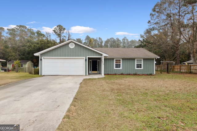 ranch-style house featuring a garage and a front lawn