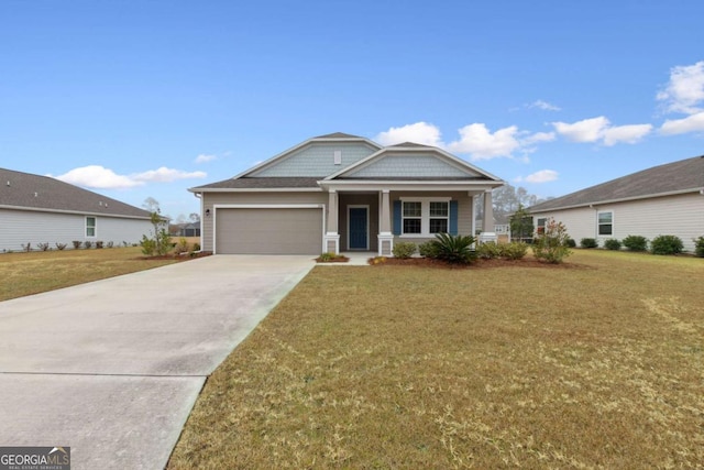 view of front of property featuring a porch, a garage, and a front yard