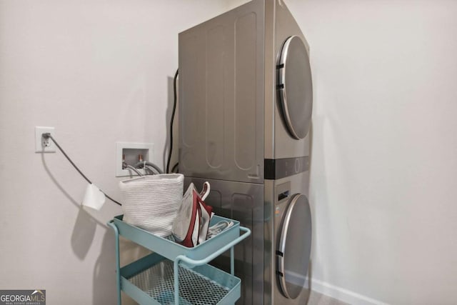washroom with stacked washer and clothes dryer