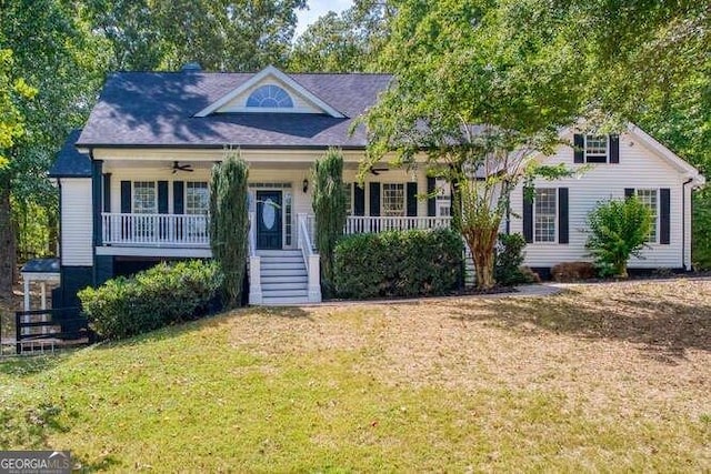 view of front of property featuring covered porch and a front yard