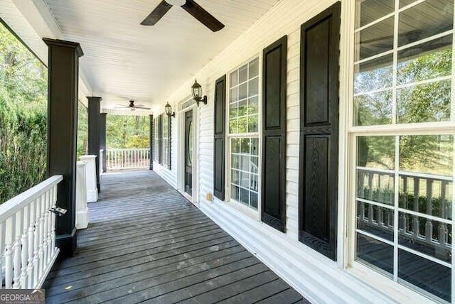 wooden deck with ceiling fan and a porch