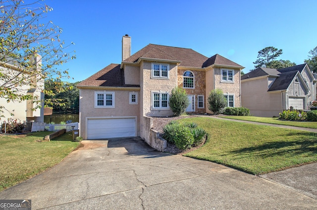 traditional-style home featuring concrete driveway, a chimney, an attached garage, fence, and a front yard